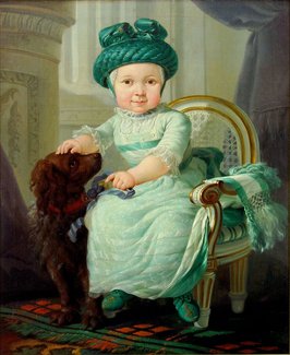 Portret van 3-jarig jongetje met valhoed en hondje